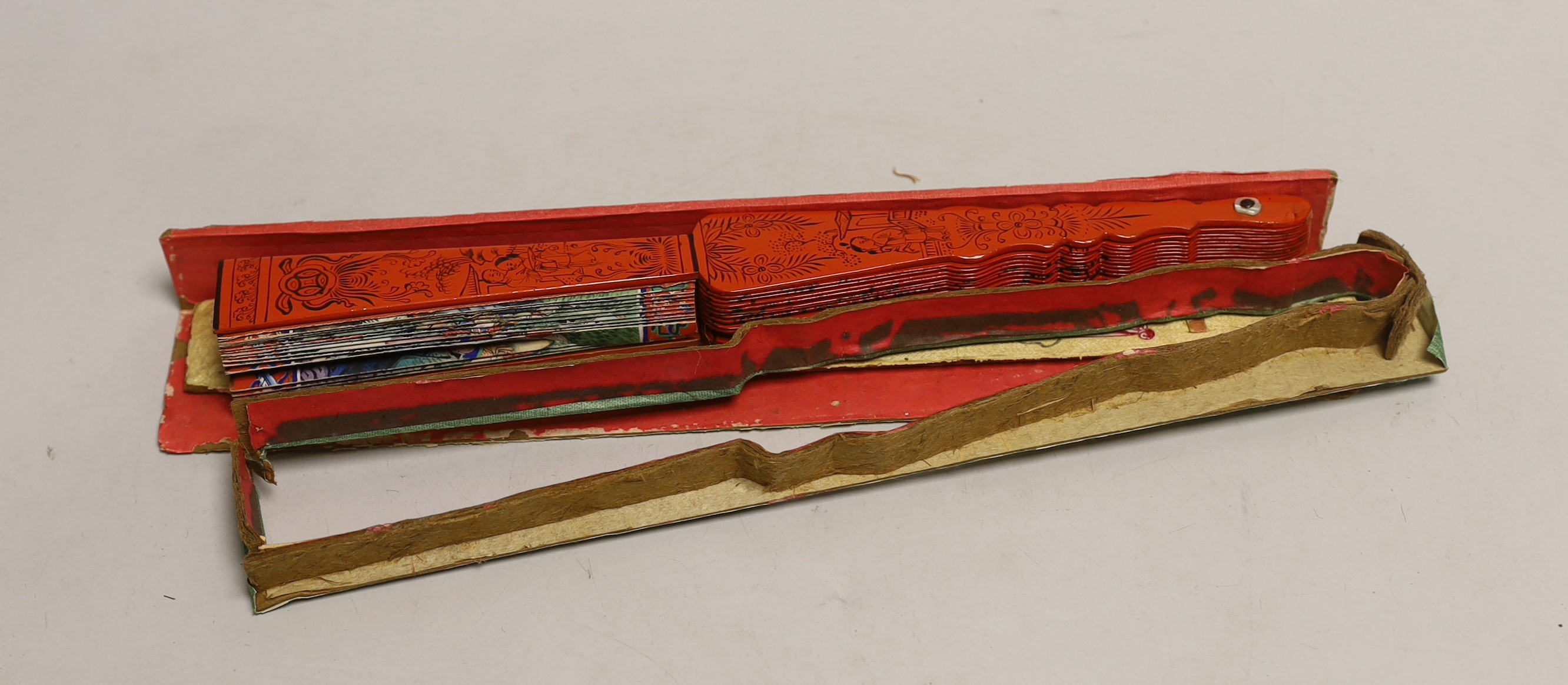 A Chinese hand painted figural fan with applied ivory faces and red lacquered guards, and boxed both damaged CITES Submission reference ERW33PQG